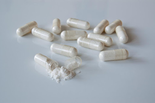 White powder inside clear probiotic capsules